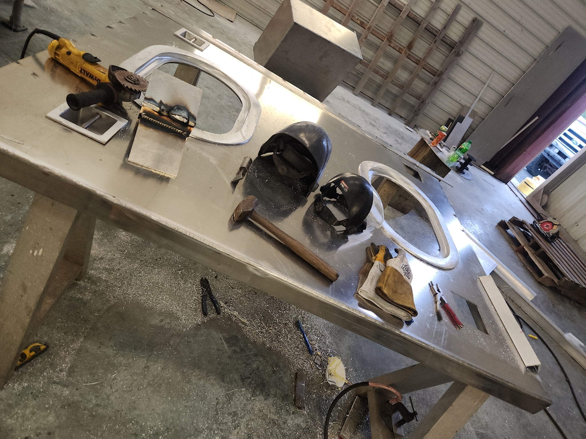 In the shop — aluminum windshield framework on the bench