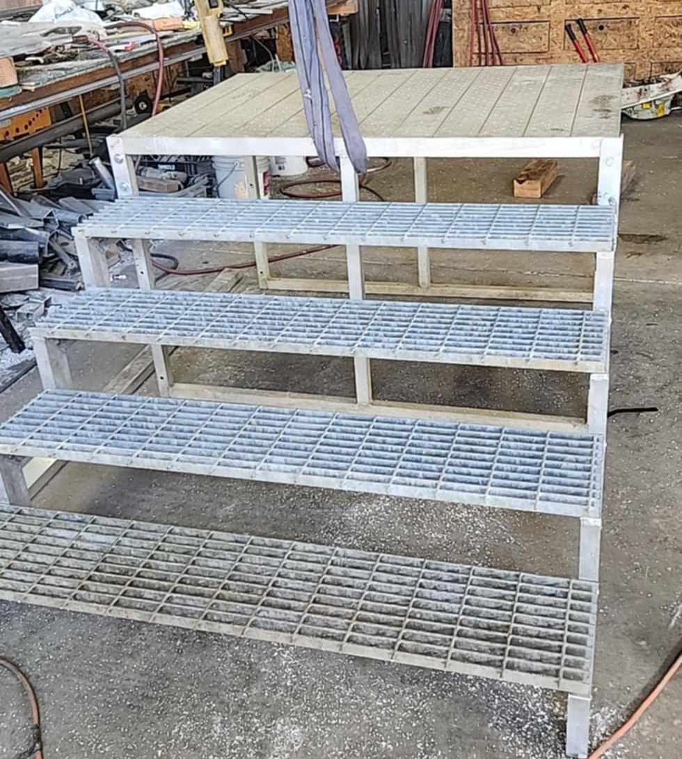 All-aluminum service stairs with welded steel grating treads