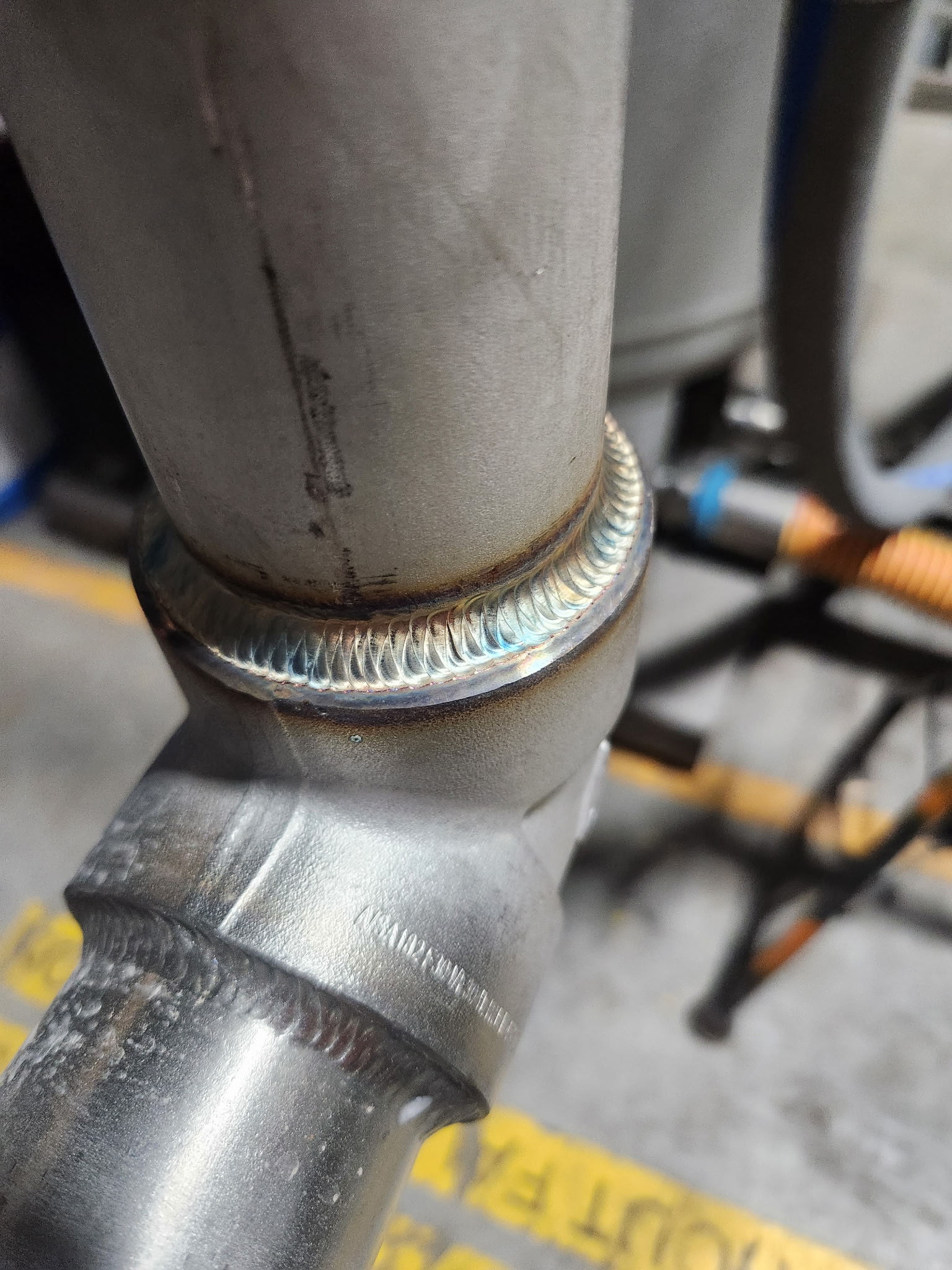 Close-up of a sanitary TIG weld on stainless process pipe